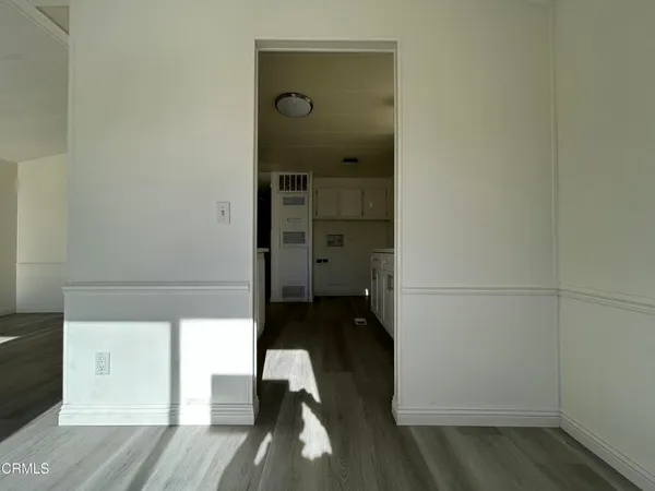 a view of cabinets and wooden floor