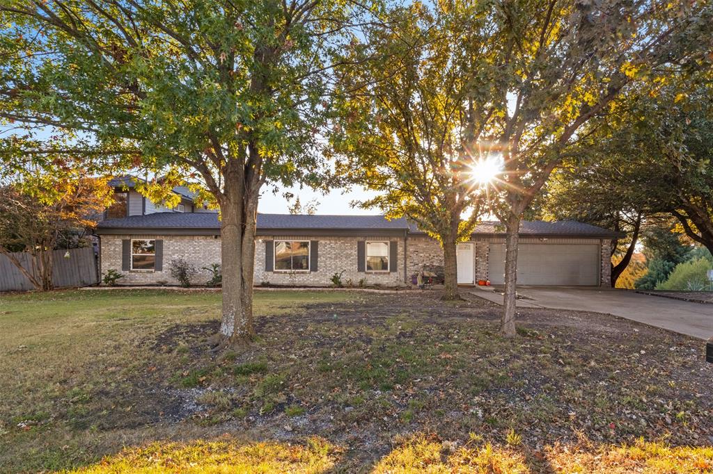 1108 Blackland Road Fate, TX 75189 - Photo 1 of 28 View of front facade featuring concrete driveway, a garage, and brick siding