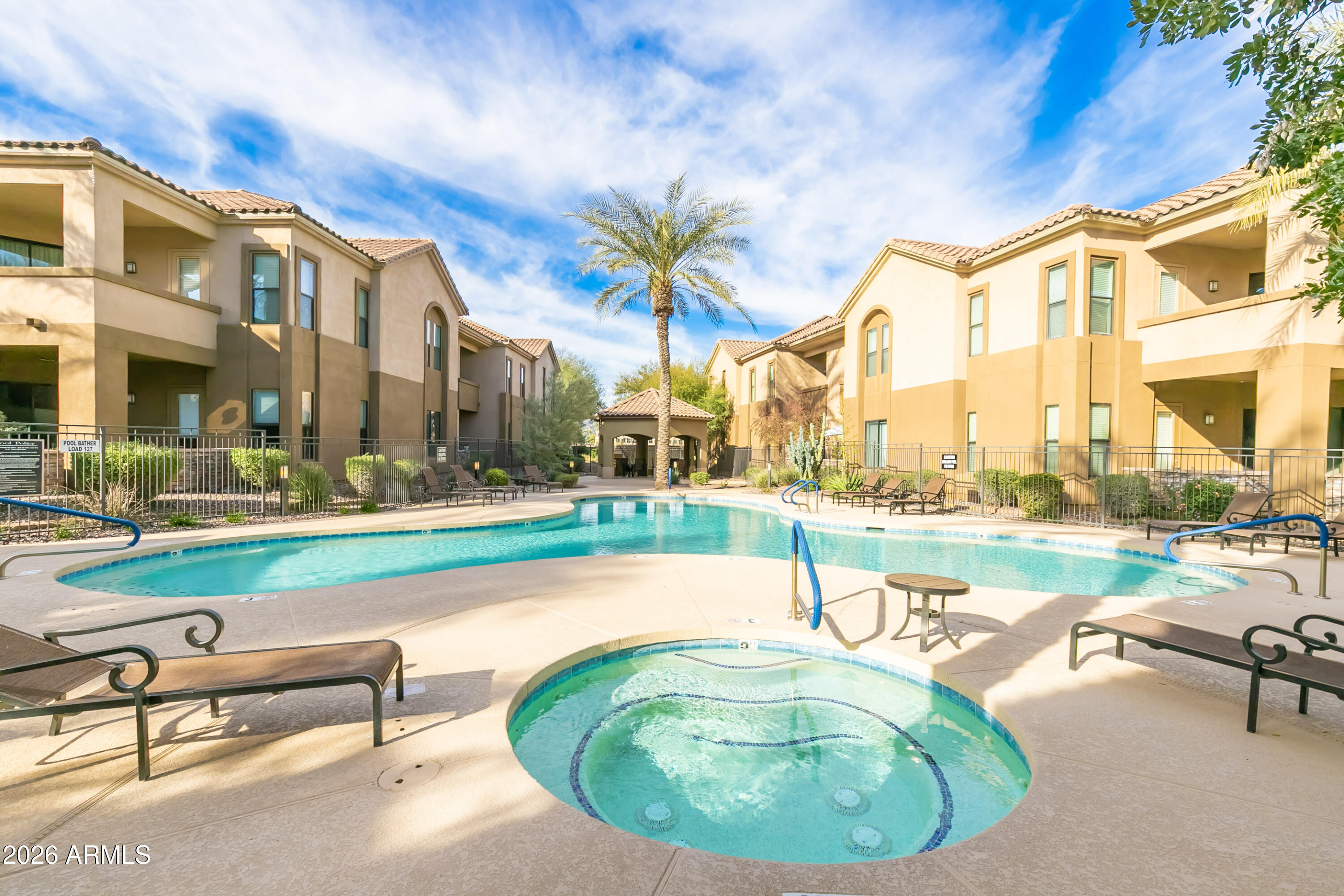 7027 North Scottsdale Road, Unit 132 Paradise Valley, AZ 85253 - Photo 26 of 48 a swimming pool with outdoor seating and yard
