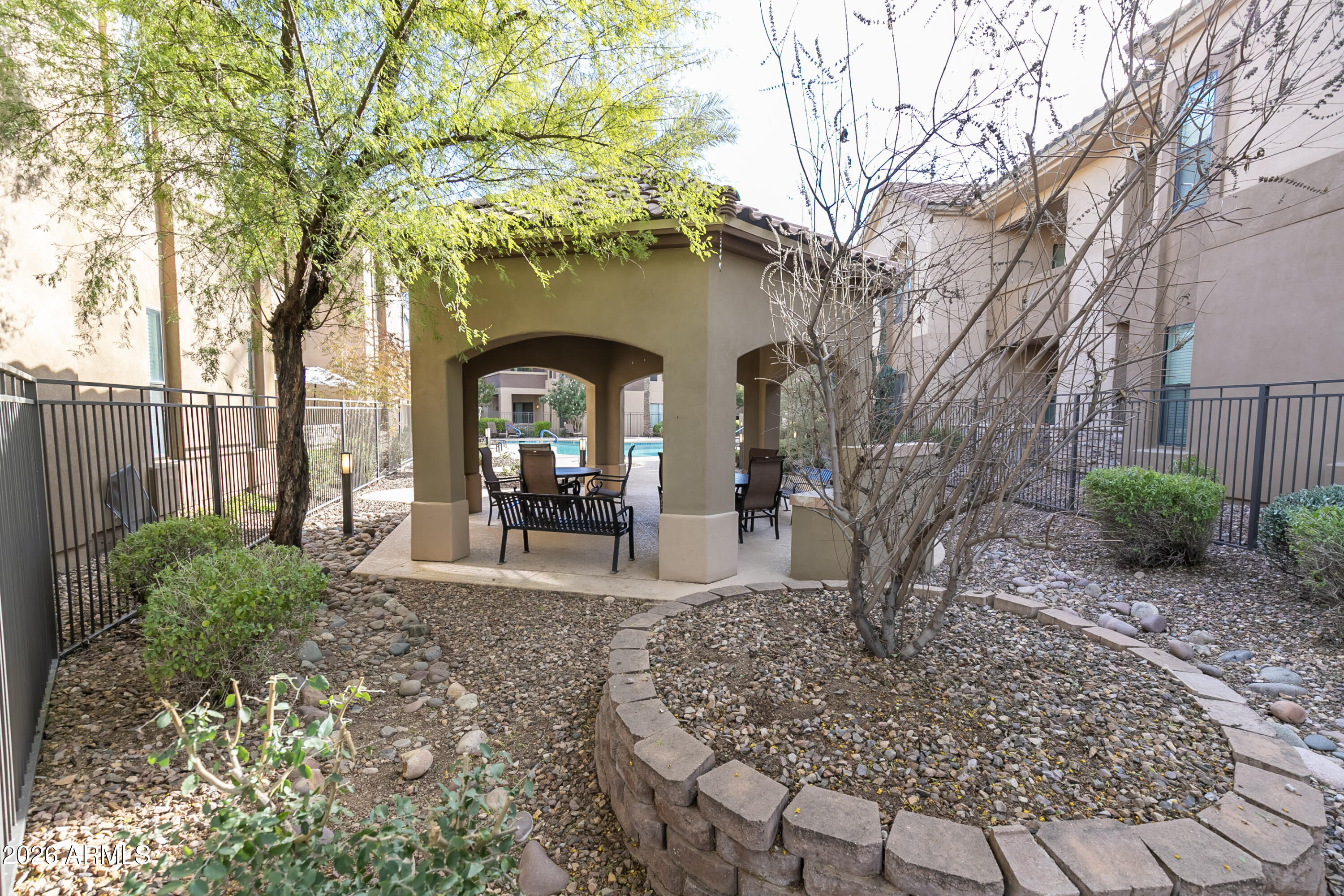 7027 North Scottsdale Road, Unit 132 Paradise Valley, AZ 85253 - Photo 27 of 48 a front view of a house with garden