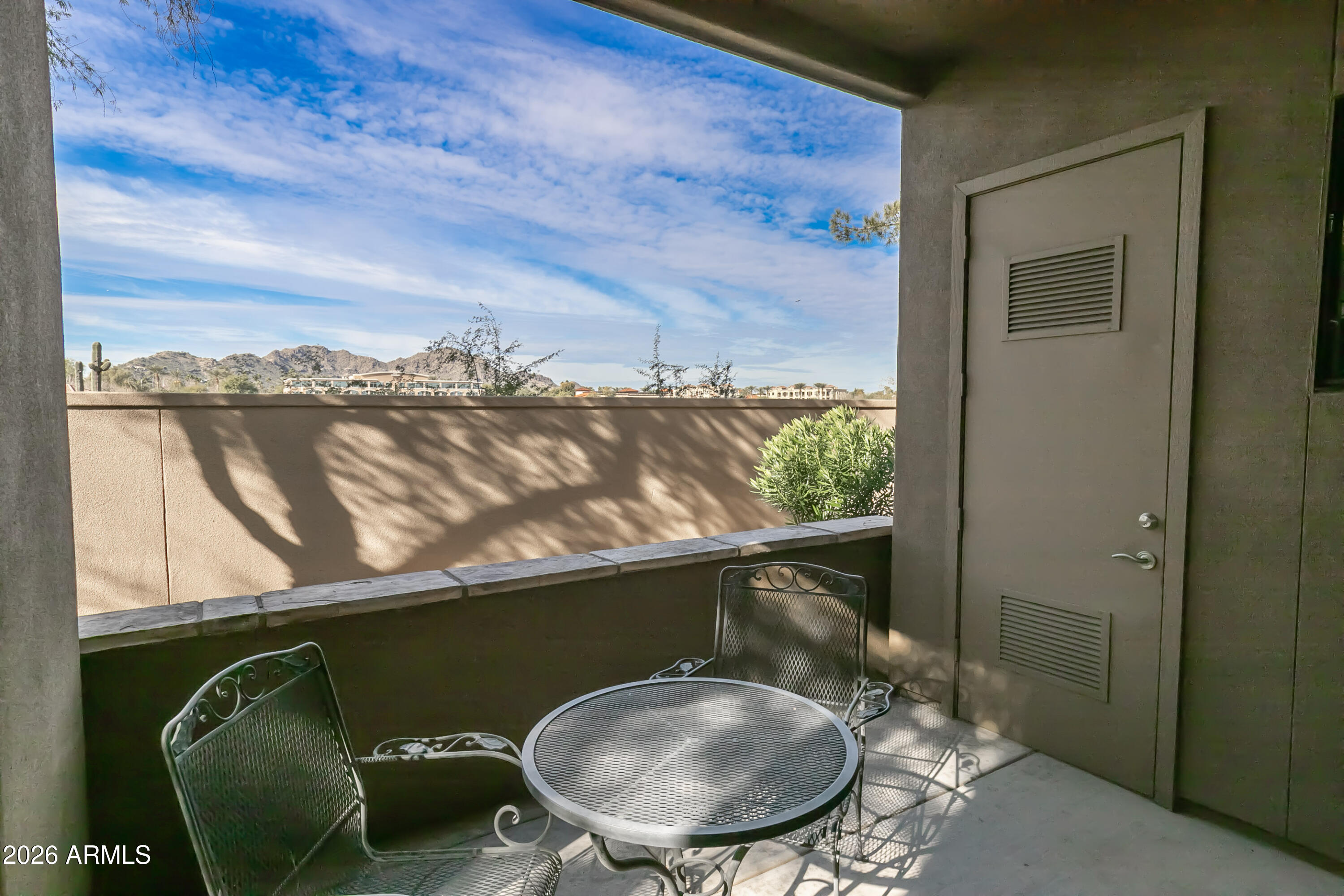7027 North Scottsdale Road, Unit 132 Paradise Valley, AZ 85253 - Photo 31 of 48 a view of a balcony with furniture and a floor to ceiling window
