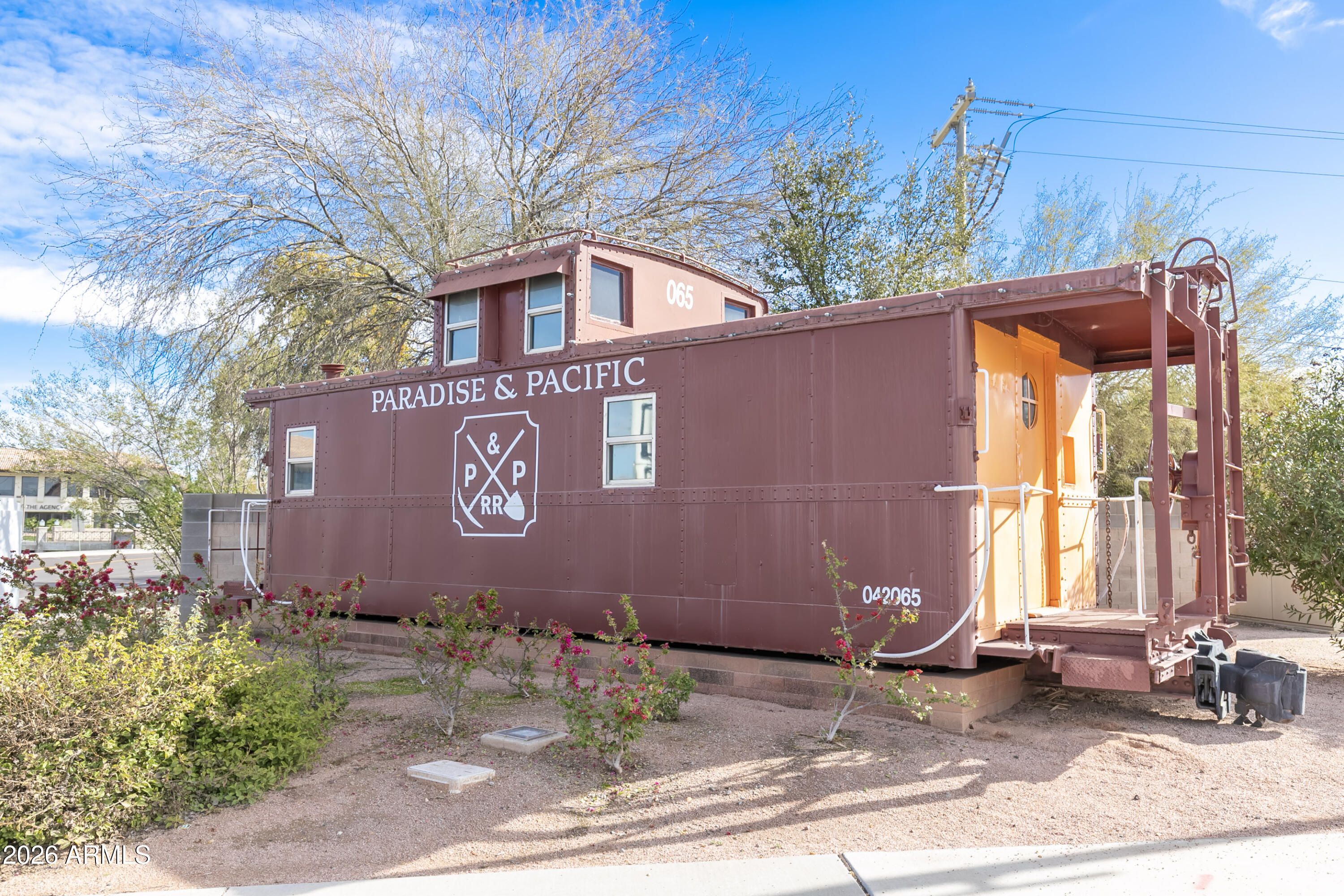 7027 North Scottsdale Road, Unit 132 Paradise Valley, AZ 85253 - Photo 40 of 48 a sign that is sitting in front of a house