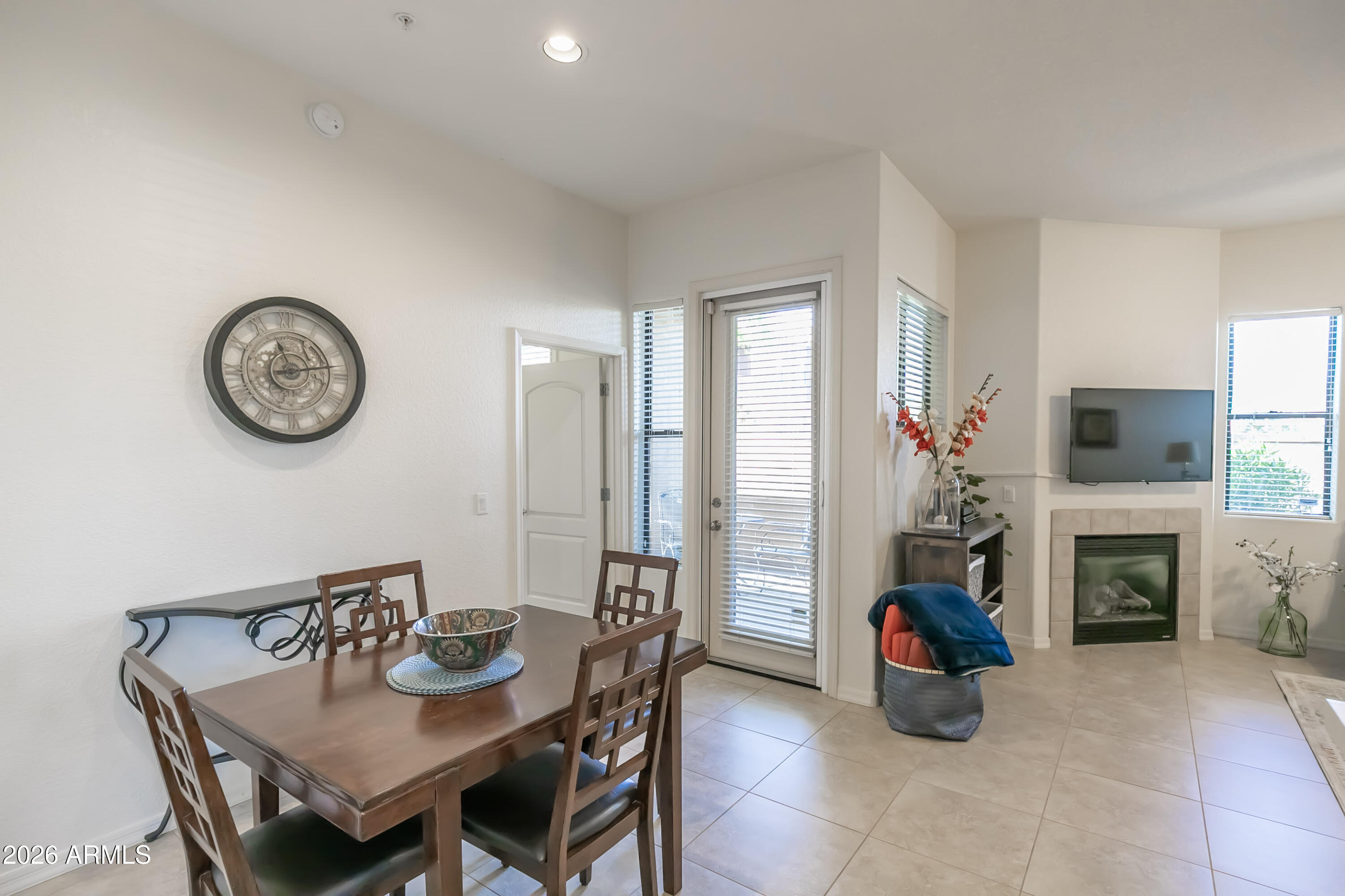 7027 North Scottsdale Road, Unit 132 Paradise Valley, AZ 85253 - Photo 8 of 48 a view of a livingroom with furniture a fireplace and a window