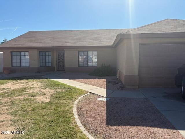 4661 West Whitten Street Chandler, AZ 85226 - Photo 3 of 17 a view of a house with a yard