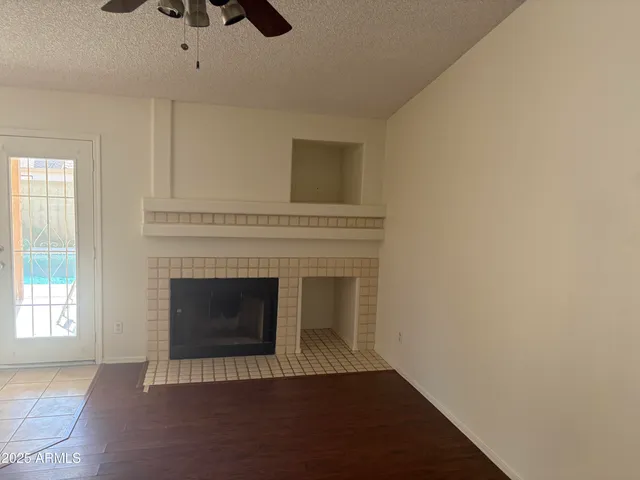 an empty room with fireplace