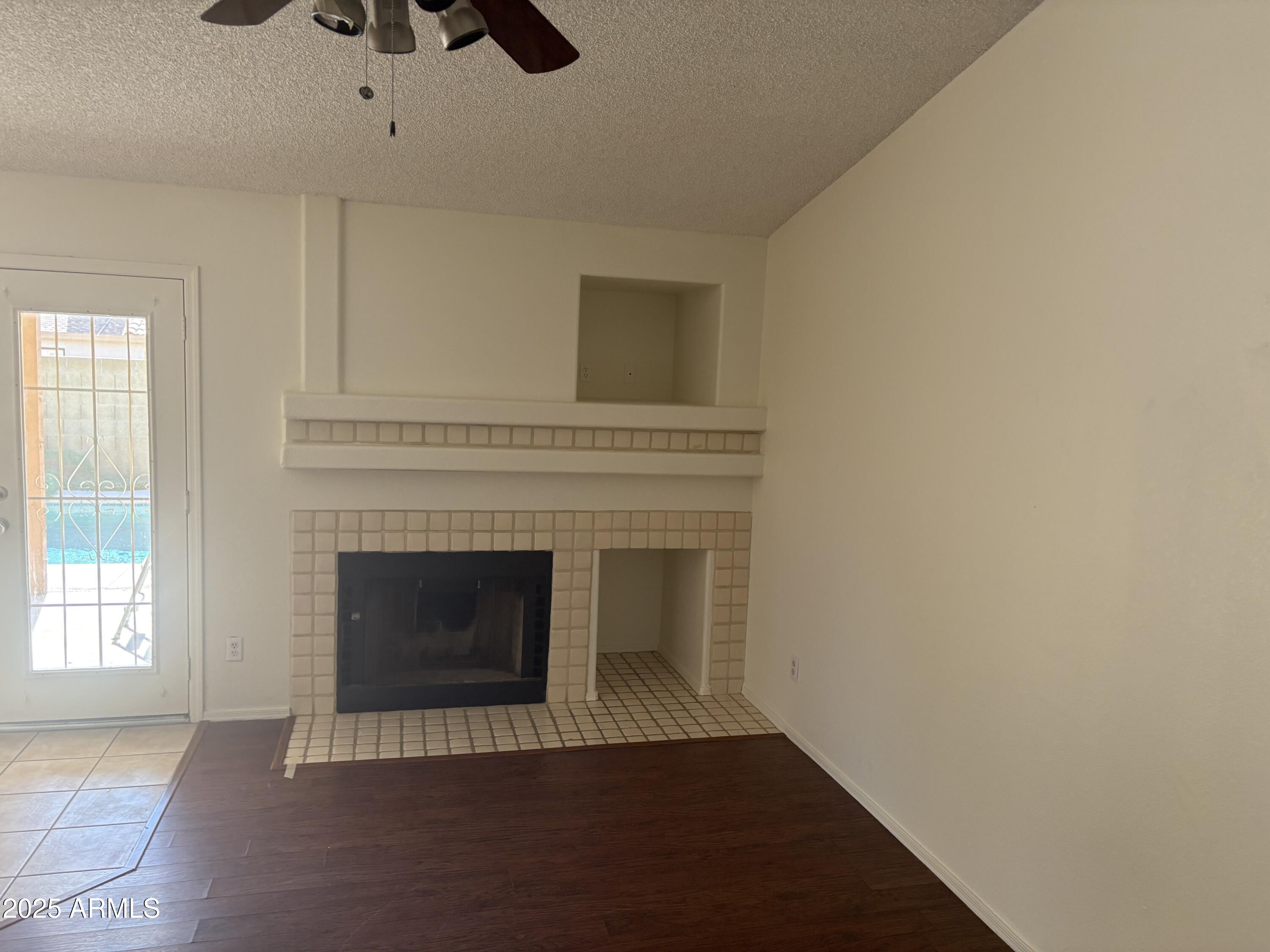 4661 West Whitten Street Chandler, AZ 85226 - Photo 4 of 17 an empty room with fireplace