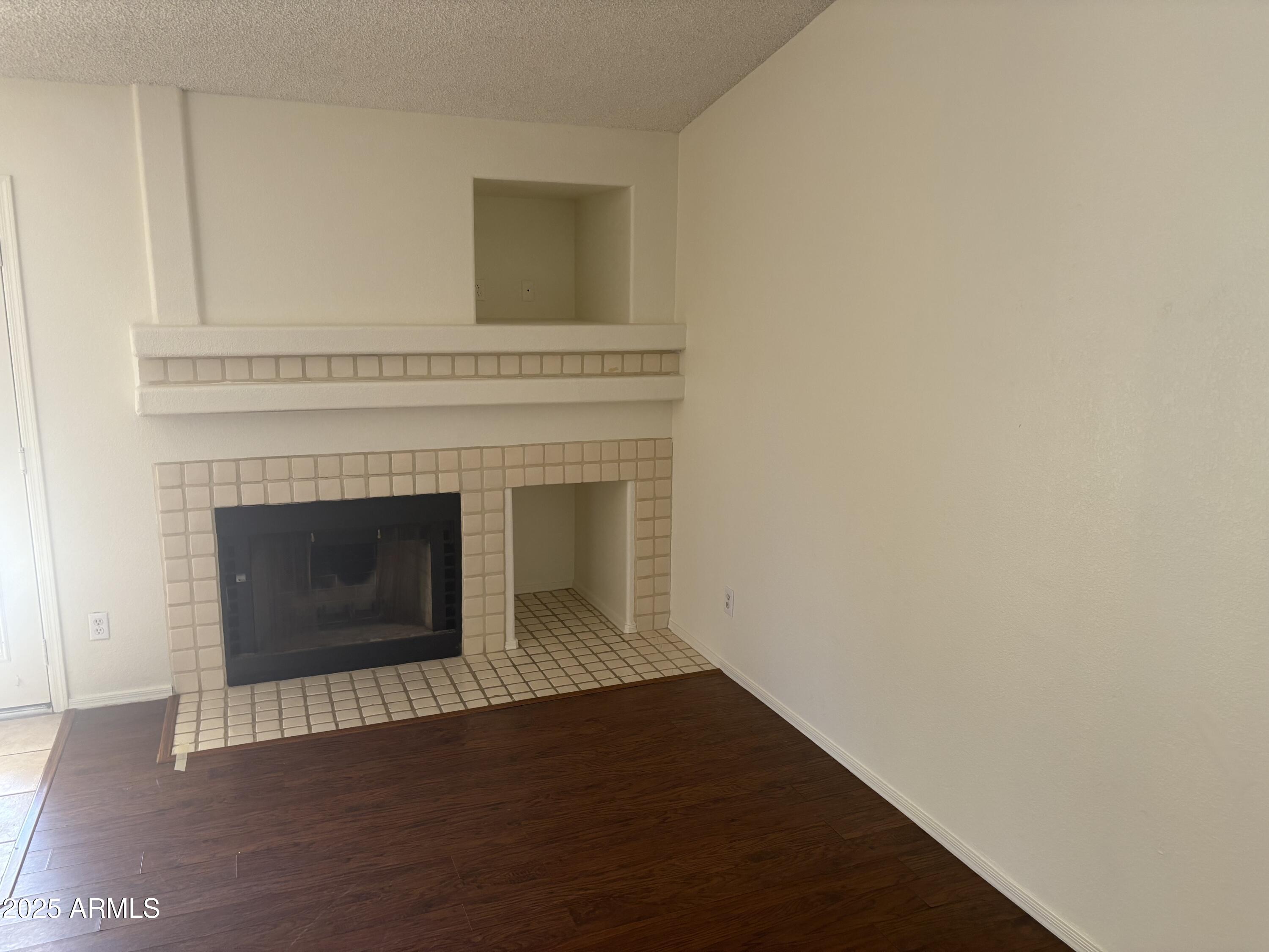 4661 West Whitten Street Chandler, AZ 85226 - Photo 5 of 17 a view of a livingroom with a fireplace