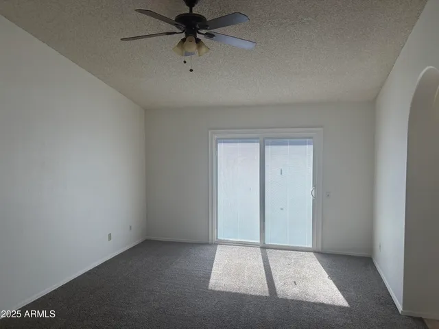 an empty room with fan
