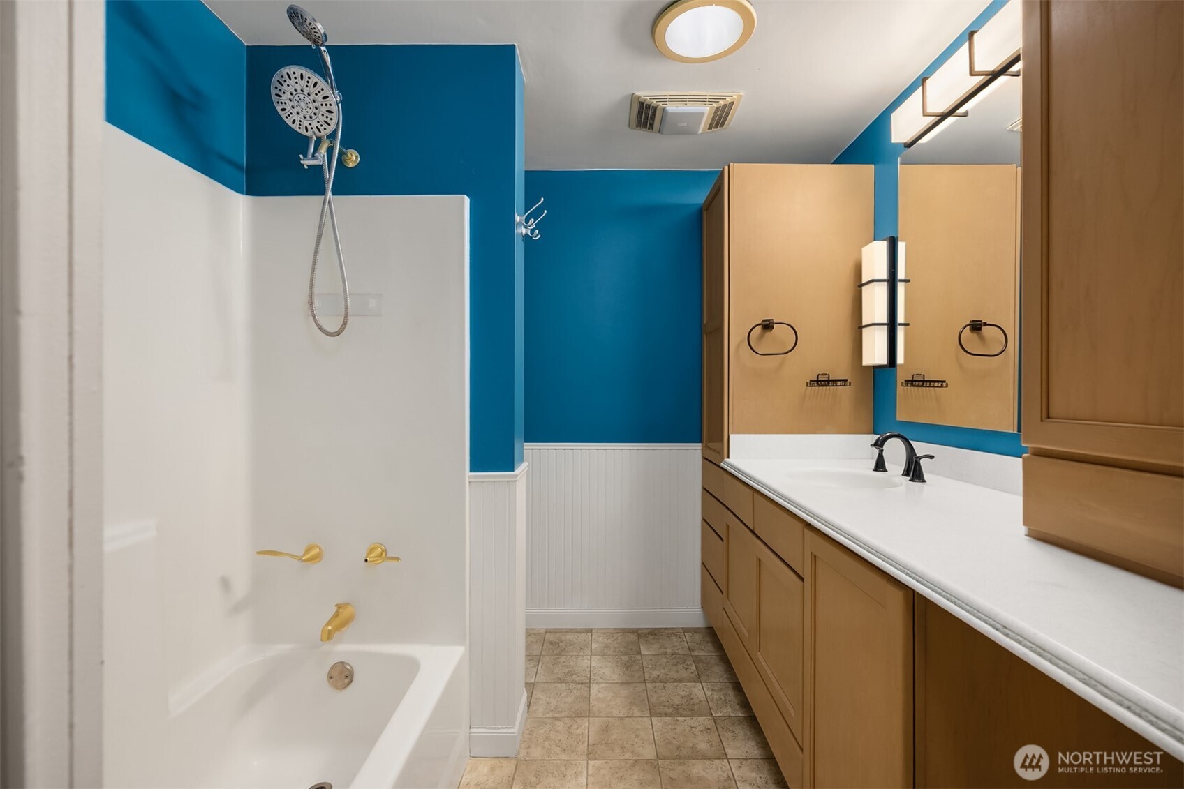 12620 Old Military Road Northeast Poulsbo, WA 98370 - Photo 15 of 35 a bathroom with a tub sink and mirror