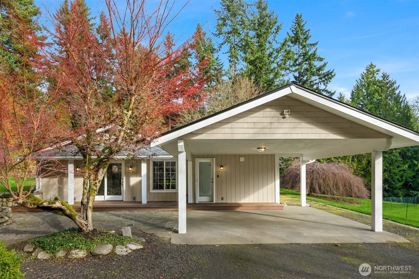 12620 Old Military Road Northeast Poulsbo, WA 98370 - Photo 3 of 35 a front view of a house with a yard