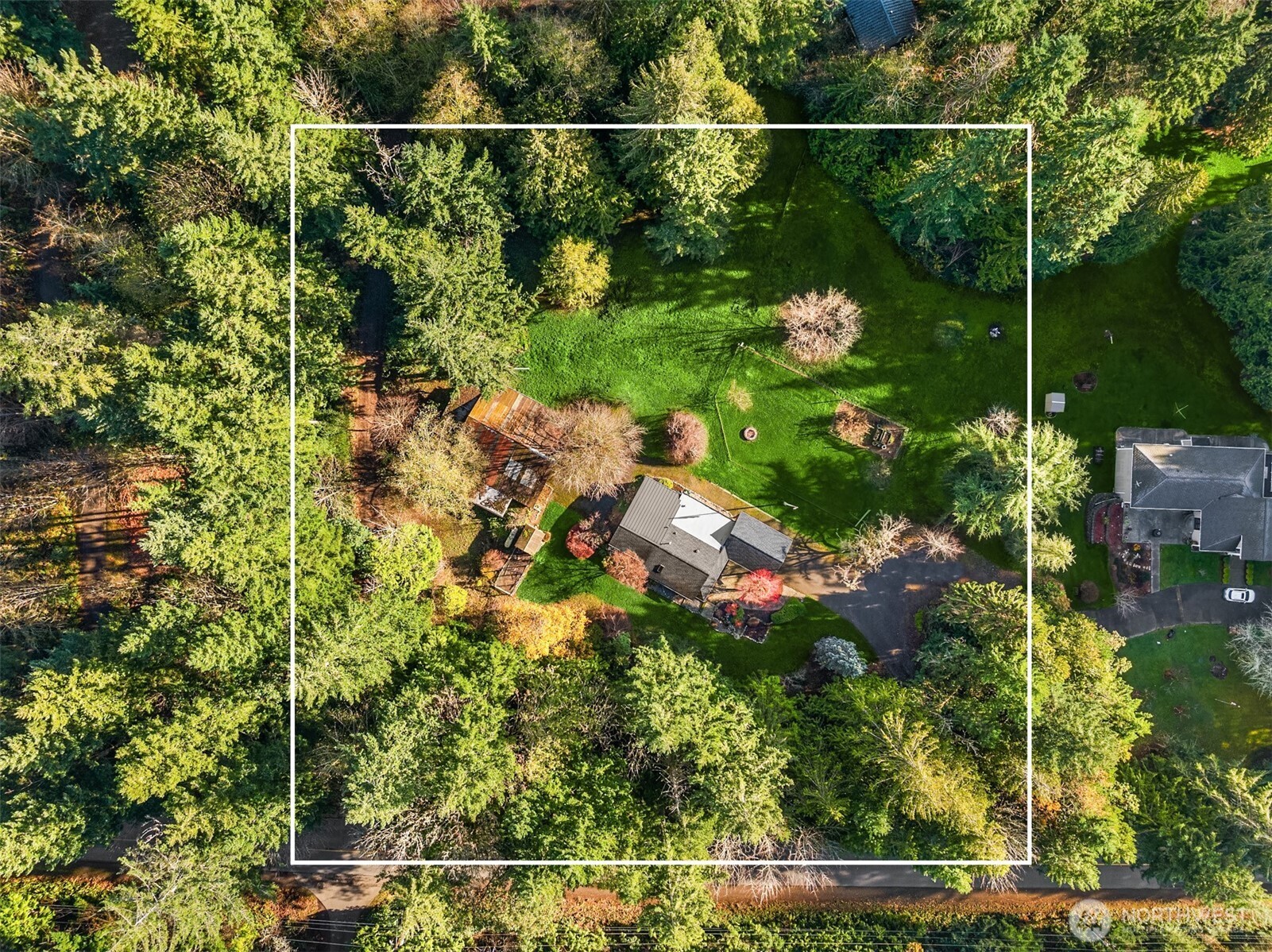 12620 Old Military Road Northeast Poulsbo, WA 98370 - Photo 33 of 35 a backyard of a house with lots of green space