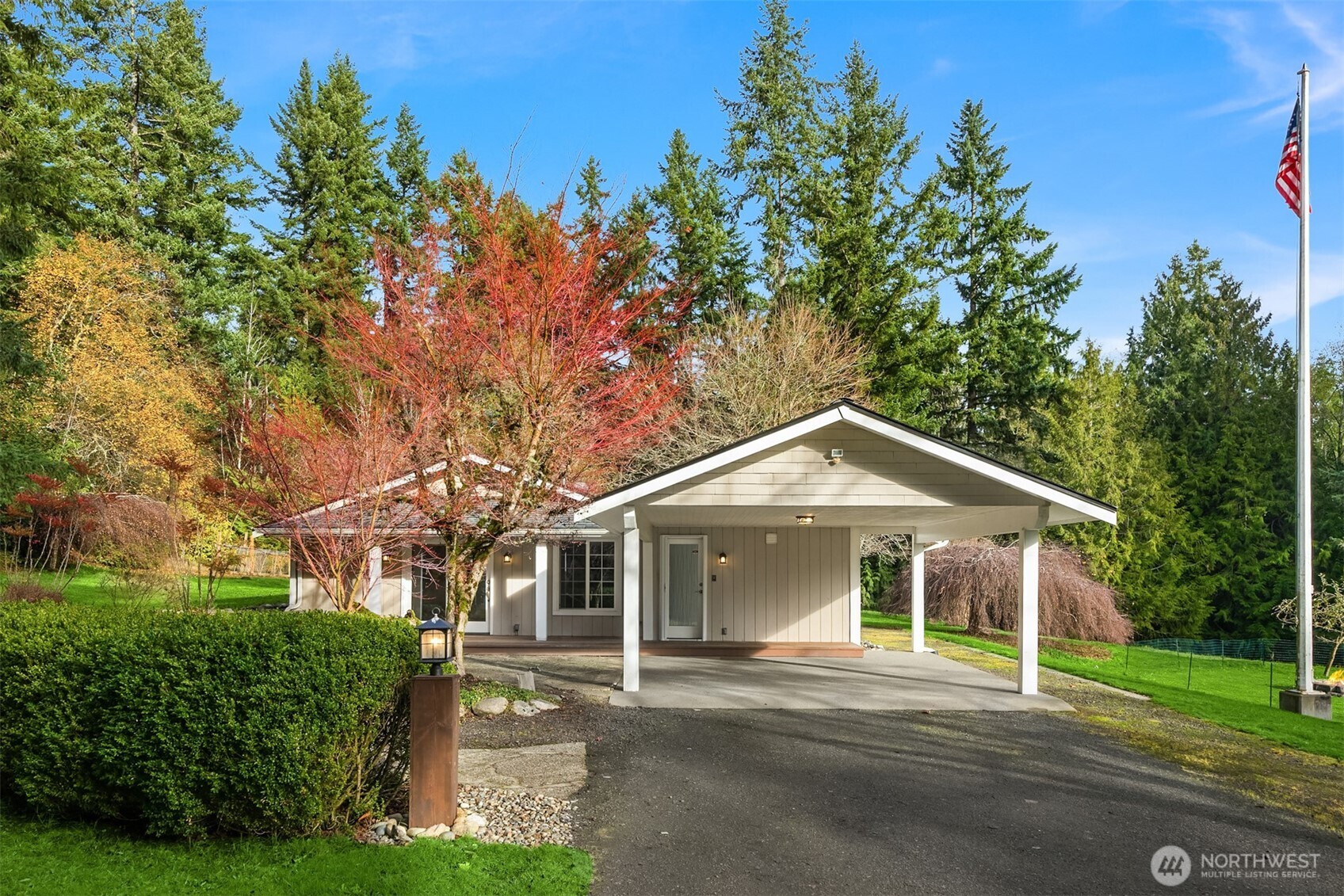 12620 Old Military Road Northeast Poulsbo, WA 98370 - Photo 4 of 35 a front view of a house with a yard
