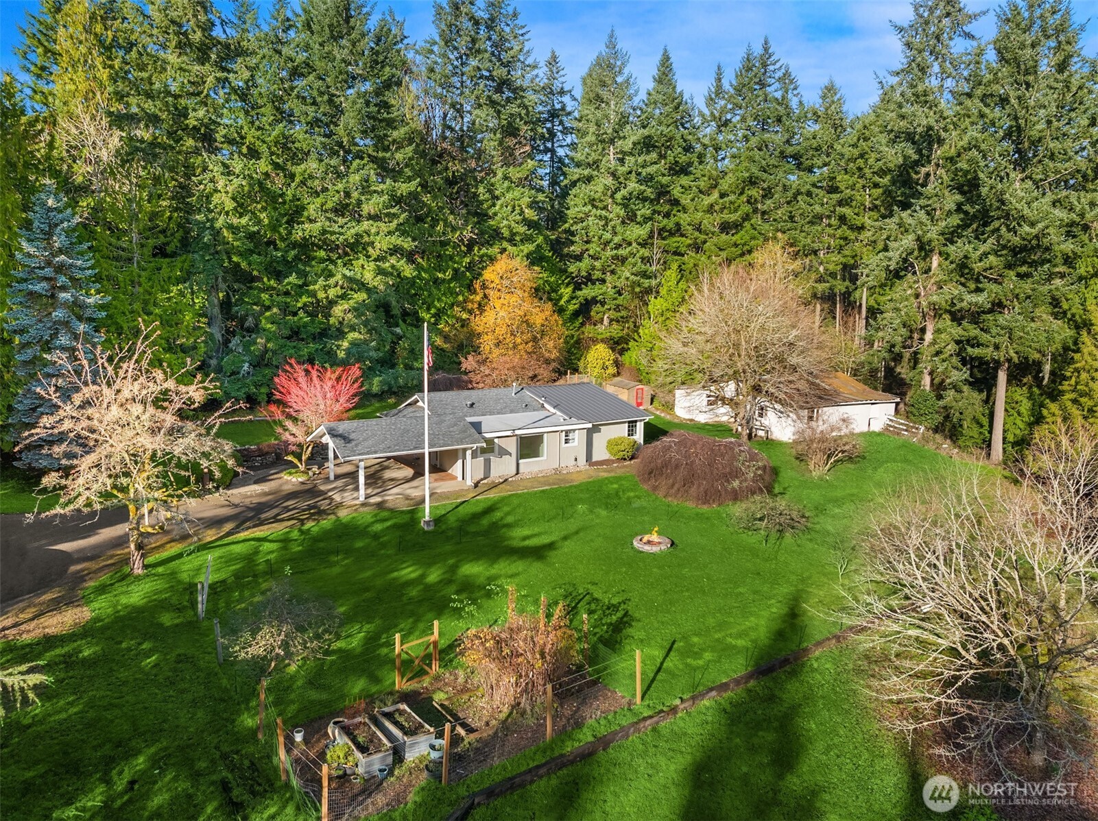 12620 Old Military Road Northeast Poulsbo, WA 98370 - Photo 6 of 35 an aerial view of residential houses with outdoor space and trees