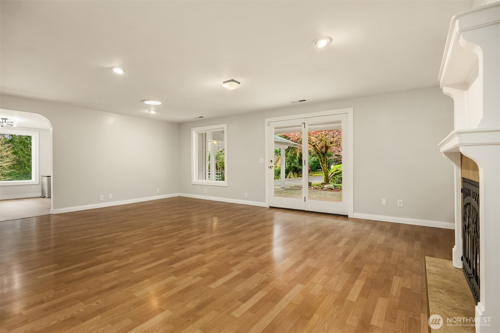 12620 Old Military Road Northeast Poulsbo, WA 98370 - Photo 10 of 35 a view of an empty room with wooden floor and a window