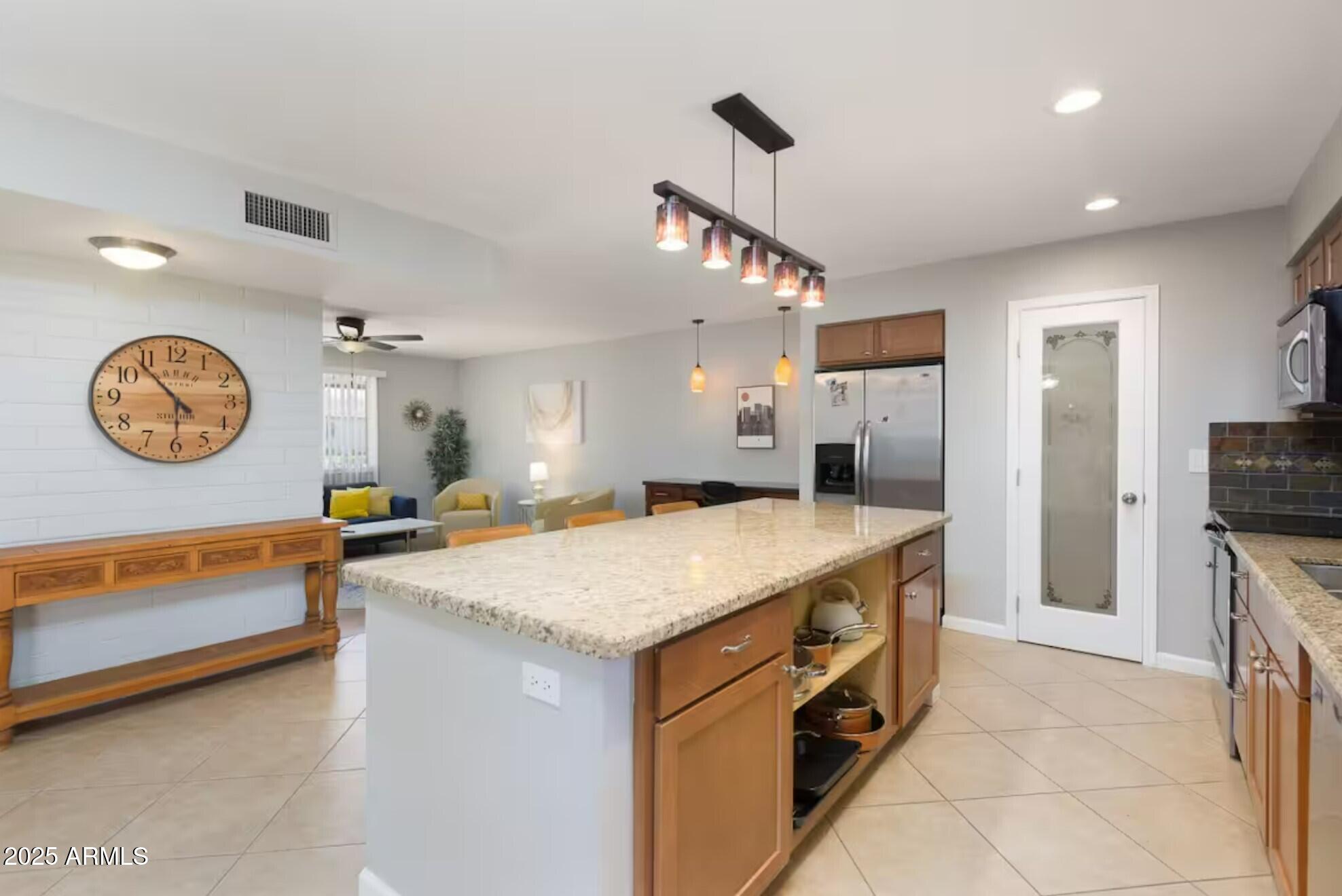 1612 West Geneva Drive Tempe, AZ 85282 - Photo 11 of 36 a kitchen with a refrigerator a sink and dishwasher