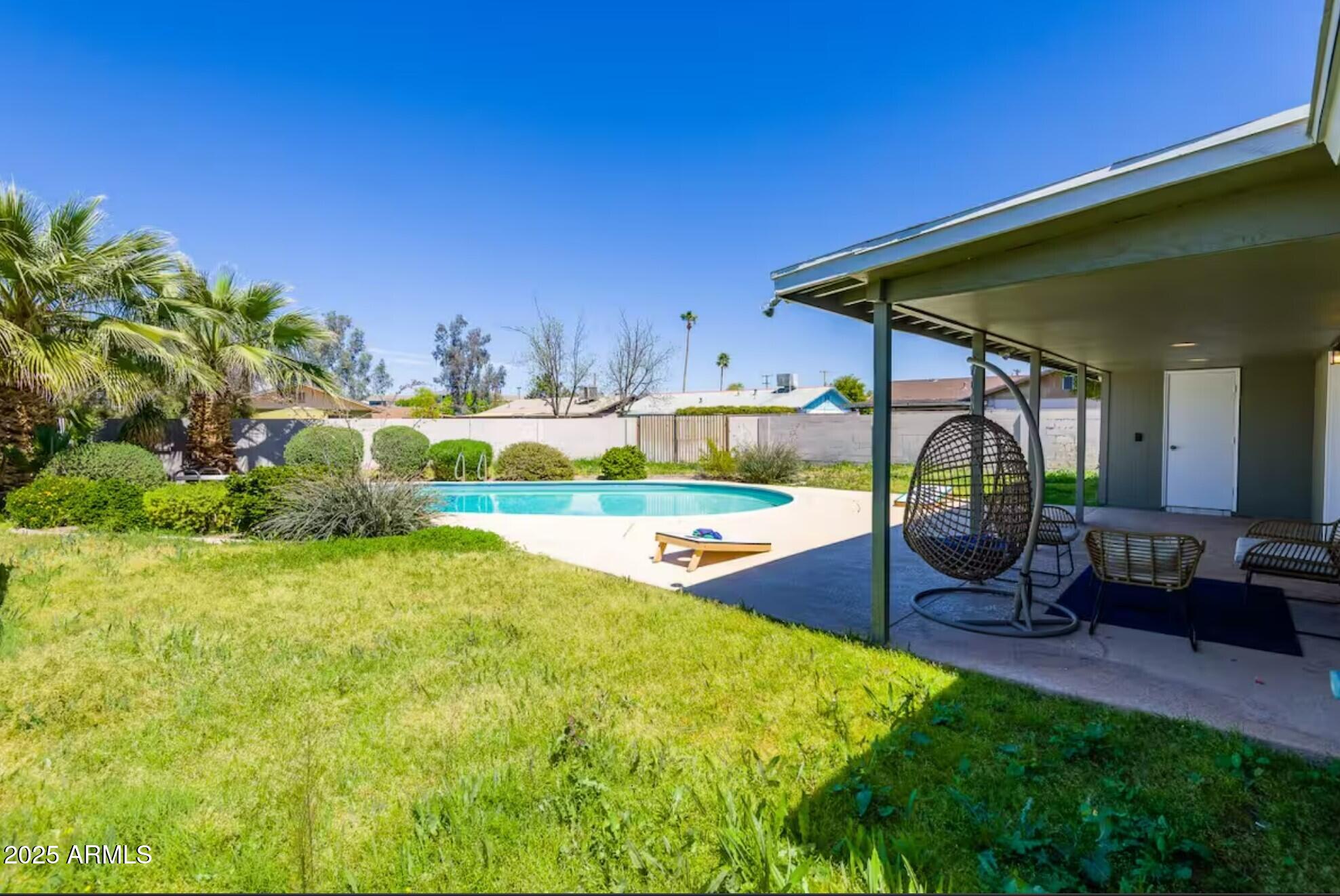 1612 West Geneva Drive Tempe, AZ 85282 - Photo 2 of 36 a view of an chairs and table in the patio
