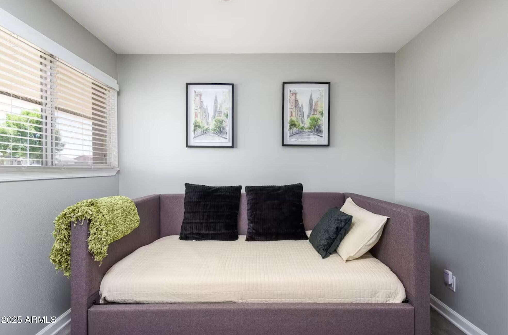 1612 West Geneva Drive Tempe, AZ 85282 - Photo 23 of 36 a bedroom with a bed and a window