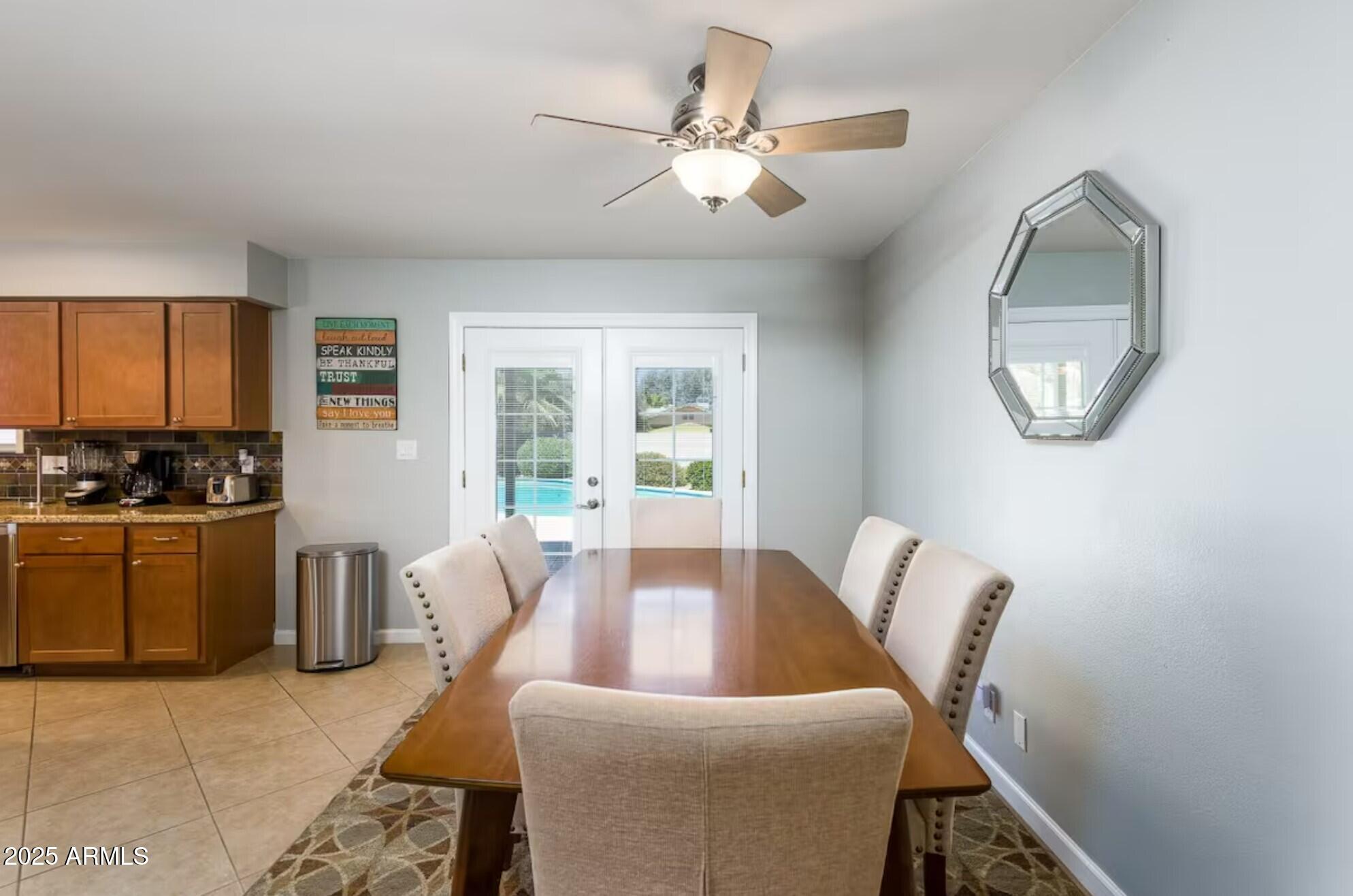 1612 West Geneva Drive Tempe, AZ 85282 - Photo 25 of 36 a living room with furniture and a stove