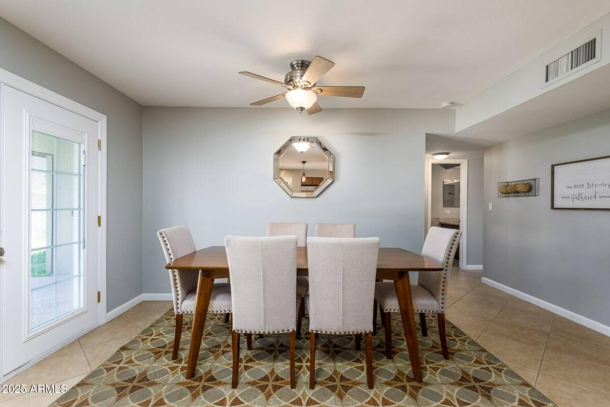 1612 West Geneva Drive Tempe, AZ 85282 - Photo 26 of 36 a view of a dining room with a table and chairs