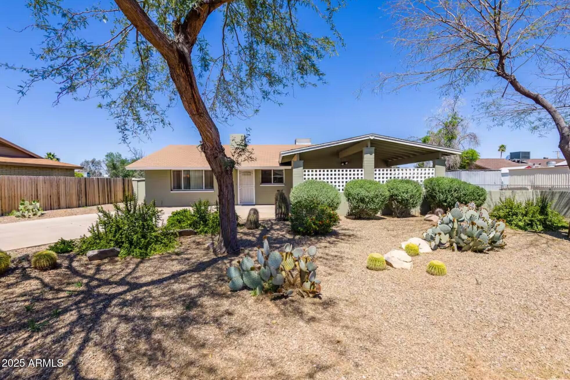 1612 West Geneva Drive Tempe, AZ 85282 - Photo 35 of 36 a front view of a house with a yard