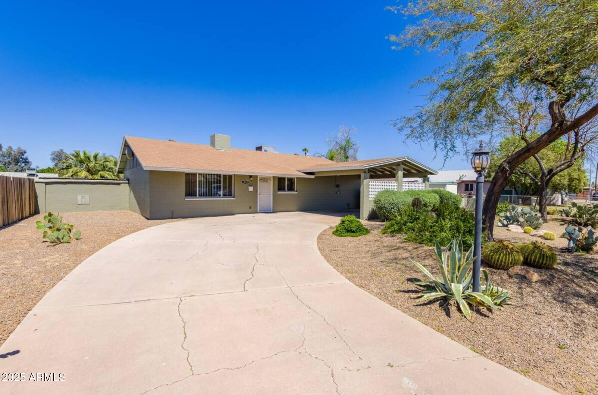 1612 West Geneva Drive Tempe, AZ 85282 - Photo 36 of 36 a view of a house with backyard and sitting area