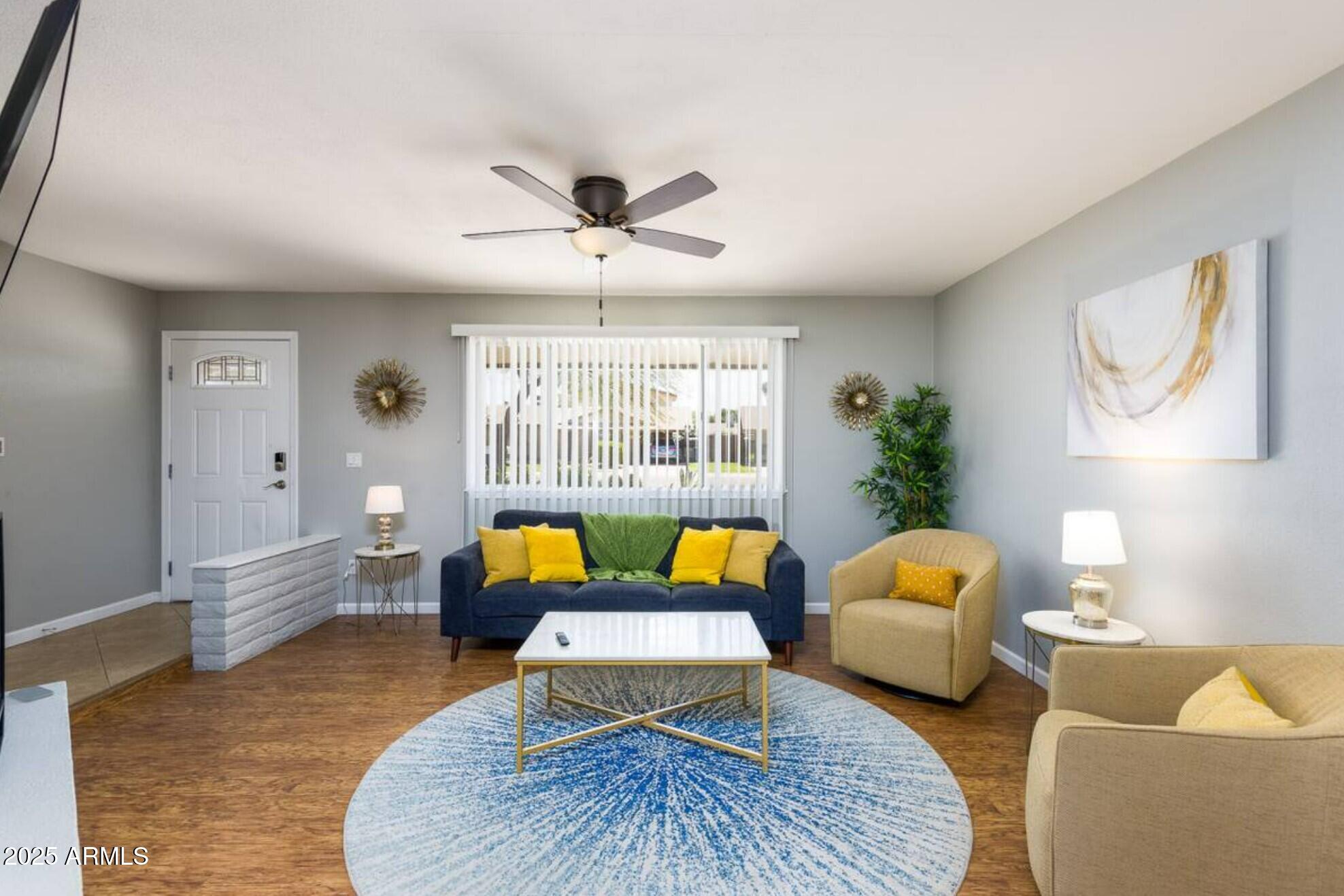 1612 West Geneva Drive Tempe, AZ 85282 - Photo 4 of 36 a living room with furniture and wooden floor