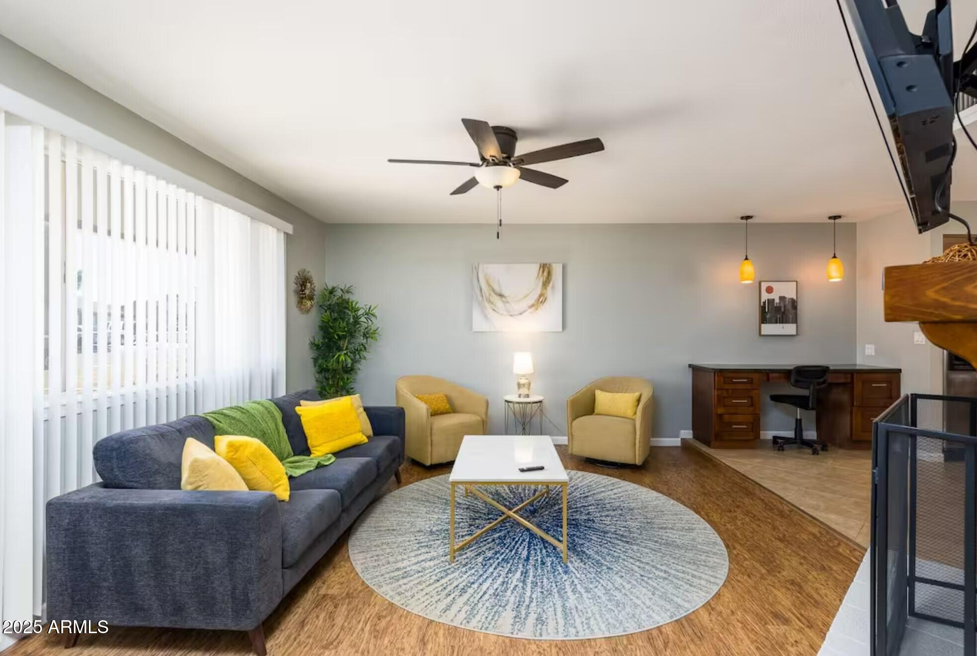 1612 West Geneva Drive Tempe, AZ 85282 - Photo 5 of 36 a living room with furniture and a table