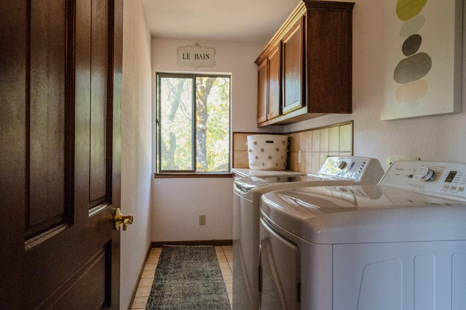 27689 Table Meadow Road Auburn, CA 95602 - Photo 70 of 72 a kitchen with stainless steel appliances granite countertop a sink and a refrigerator