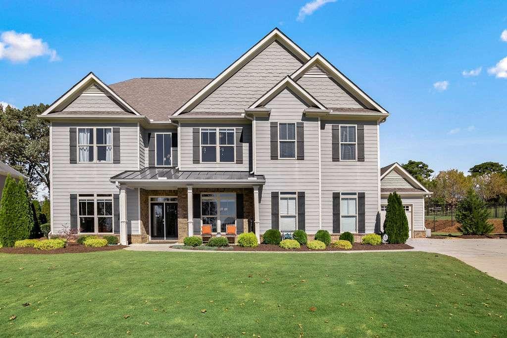 971 Traditions Way Jefferson, GA 30549 - Photo 1 of 1 a front view of a house with a garden