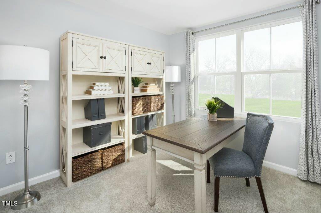 165 Sunny Acrs Road Raleigh, NC 27603 - Photo 11 of 17 a view of a workspace with furniture and a window