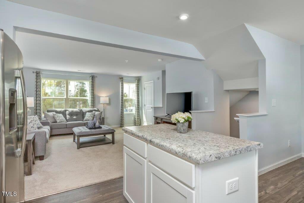 165 Sunny Acrs Road Raleigh, NC 27603 - Photo 4 of 17 a view of living room with granite countertop couches and fireplace