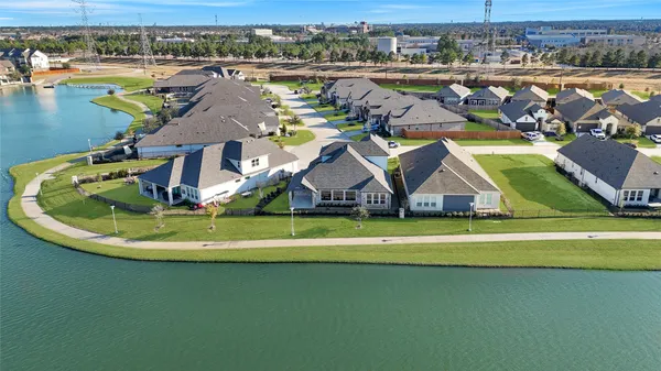 a view of a lake with a house in the background