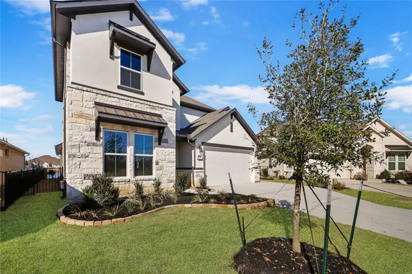 a bathroom with a bathtub shower sink vanity and toilet