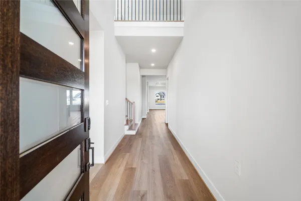 a large kitchen with kitchen island a sink stainless steel appliances and cabinets