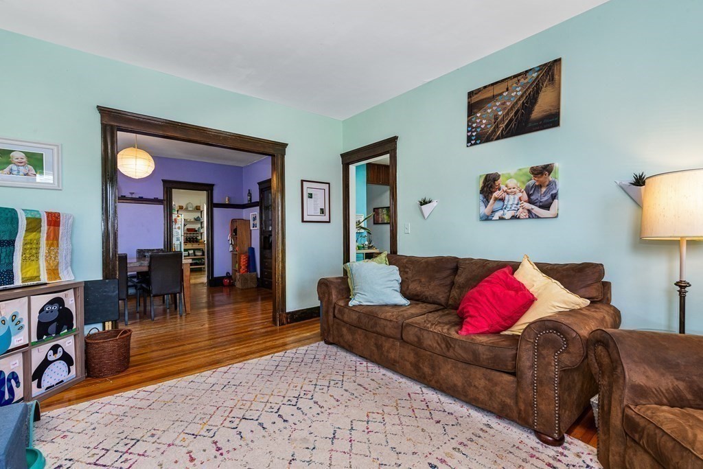 87 Parkton Road Boston, MA 02130 - Photo 11 of 42 a living room with furniture and dresser