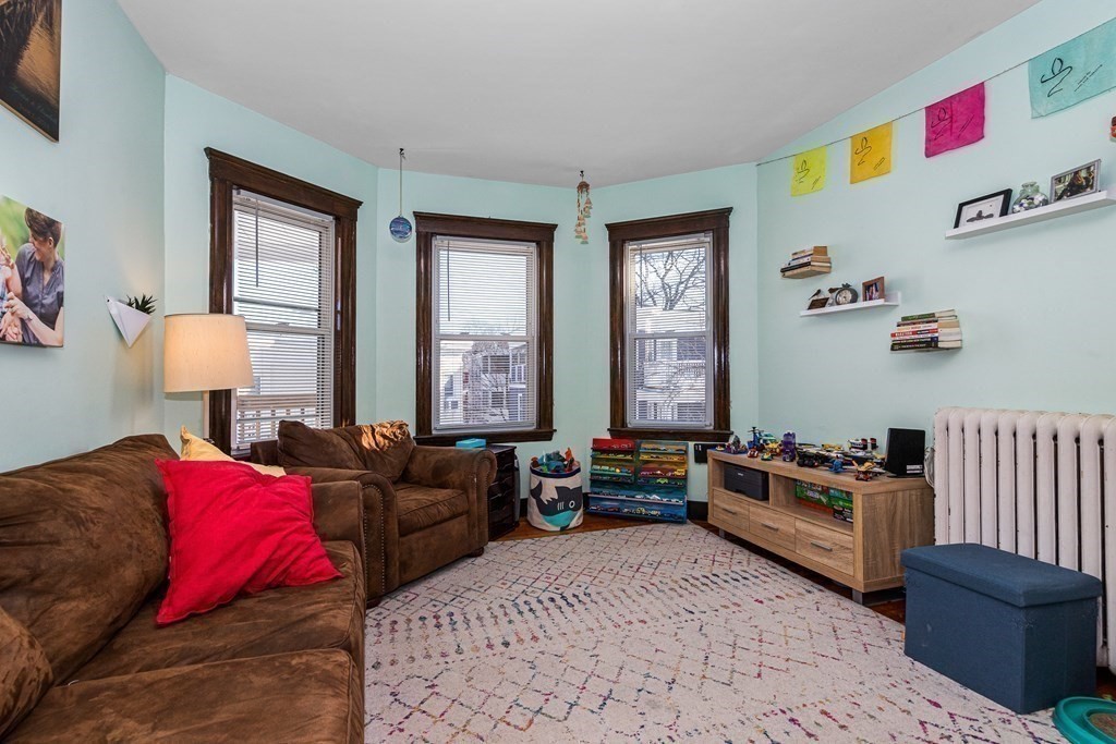 87 Parkton Road Boston, MA 02130 - Photo 12 of 42 a living room with furniture and a window