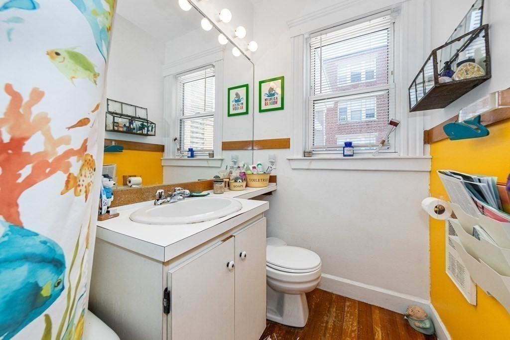 87 Parkton Road Boston, MA 02130 - Photo 17 of 42 a bathroom with a sink a vanity and a mirror