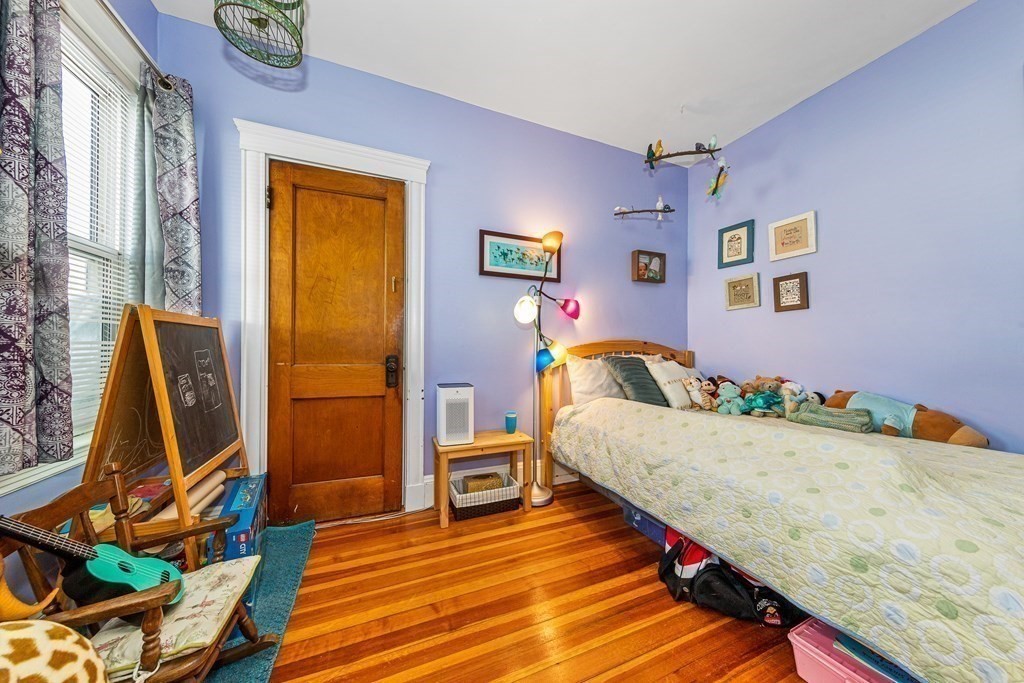 87 Parkton Road Boston, MA 02130 - Photo 19 of 42 a bed room with a bed and a window