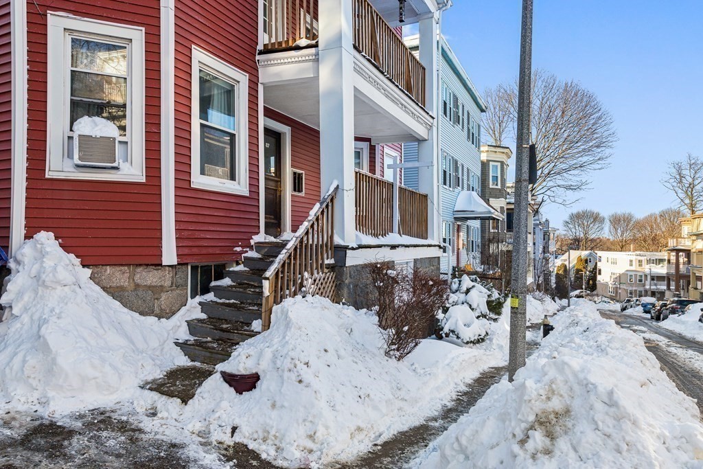 87 Parkton Road Boston, MA 02130 - Photo 2 of 42 a view of a building with snow on the road