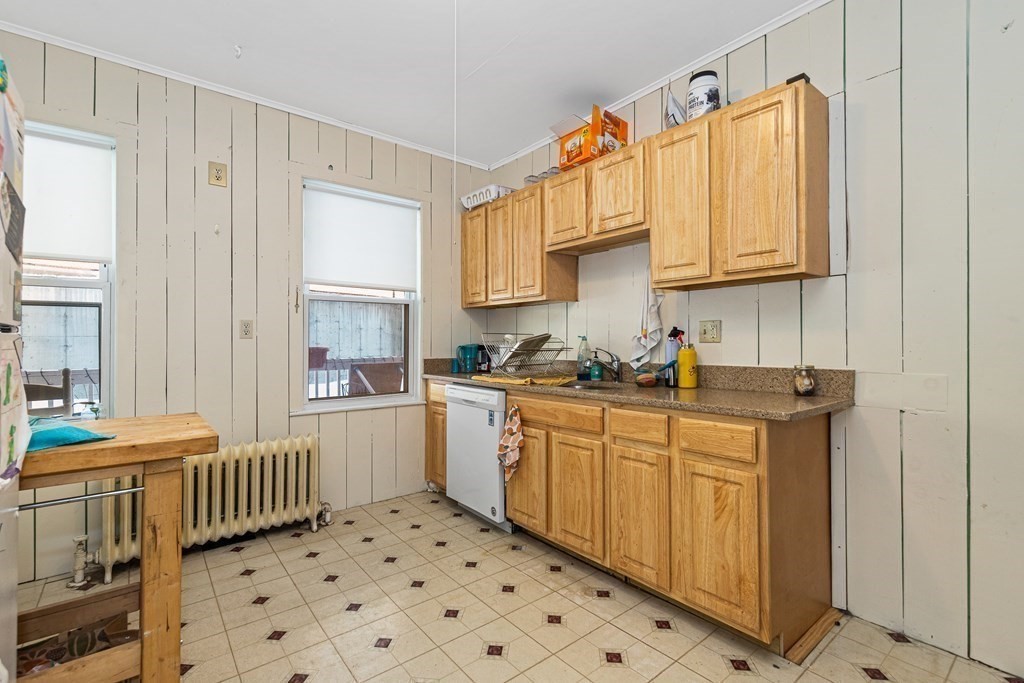 87 Parkton Road Boston, MA 02130 - Photo 21 of 42 a kitchen that has a sink and a stove in it