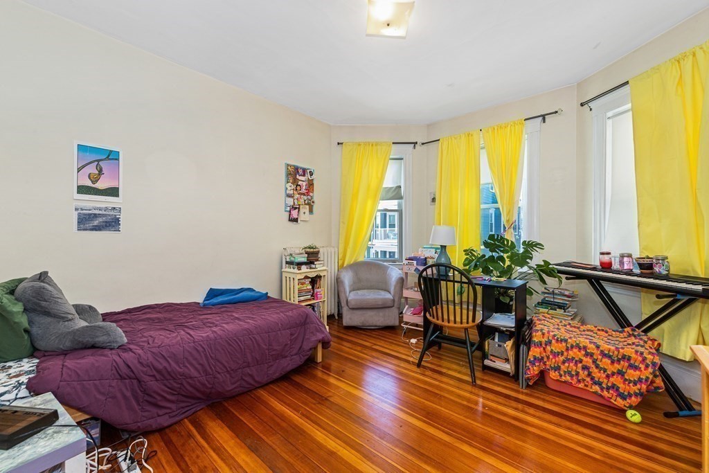 87 Parkton Road Boston, MA 02130 - Photo 25 of 42 a living room with furniture and a large window