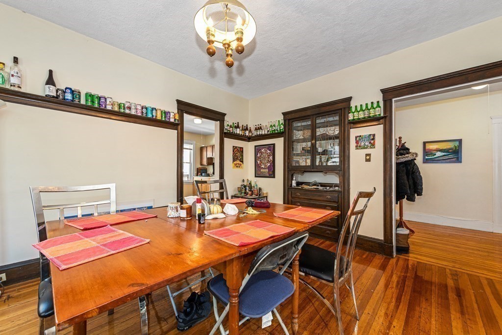 87 Parkton Road Boston, MA 02130 - Photo 30 of 42 a view of a dining room with furniture and wooden floor