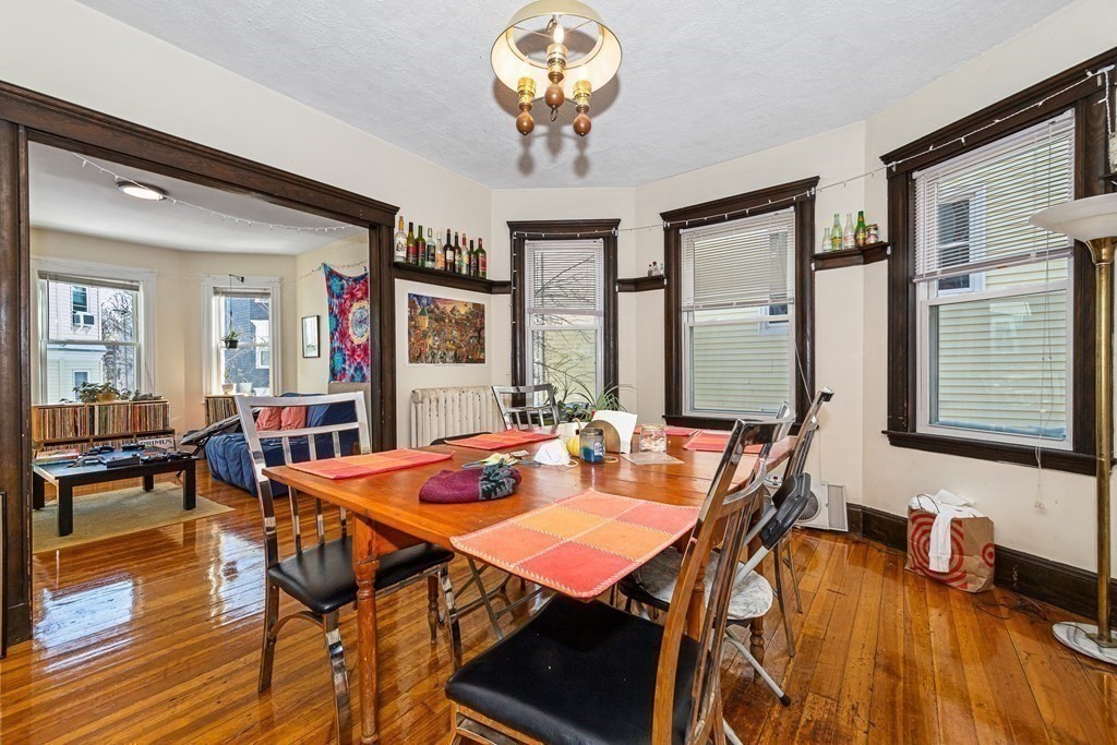 87 Parkton Road Boston, MA 02130 - Photo 31 of 42 a view of a dining room with furniture and wooden floor