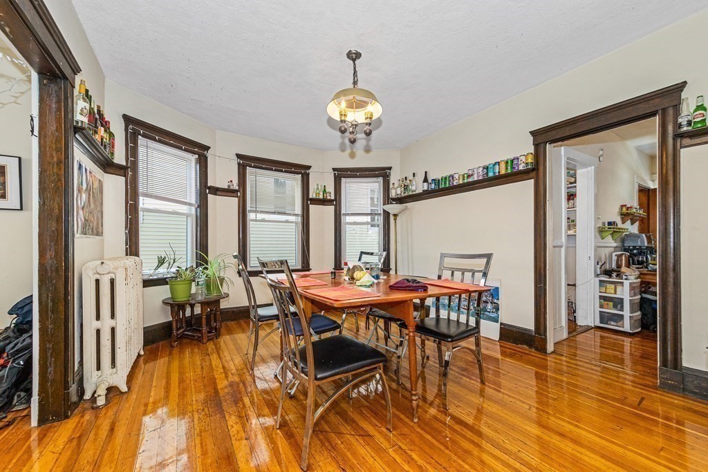 87 Parkton Road Boston, MA 02130 - Photo 33 of 42 a view of a dining room with furniture window and wooden floor