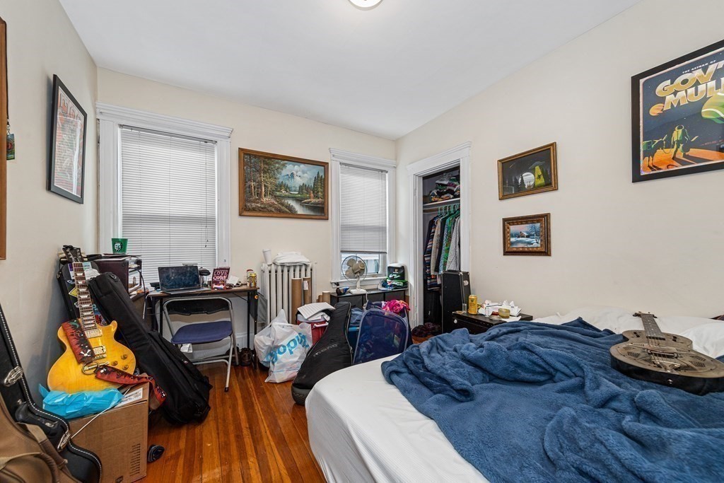 87 Parkton Road Boston, MA 02130 - Photo 36 of 42 a living room with furniture and wooden floor
