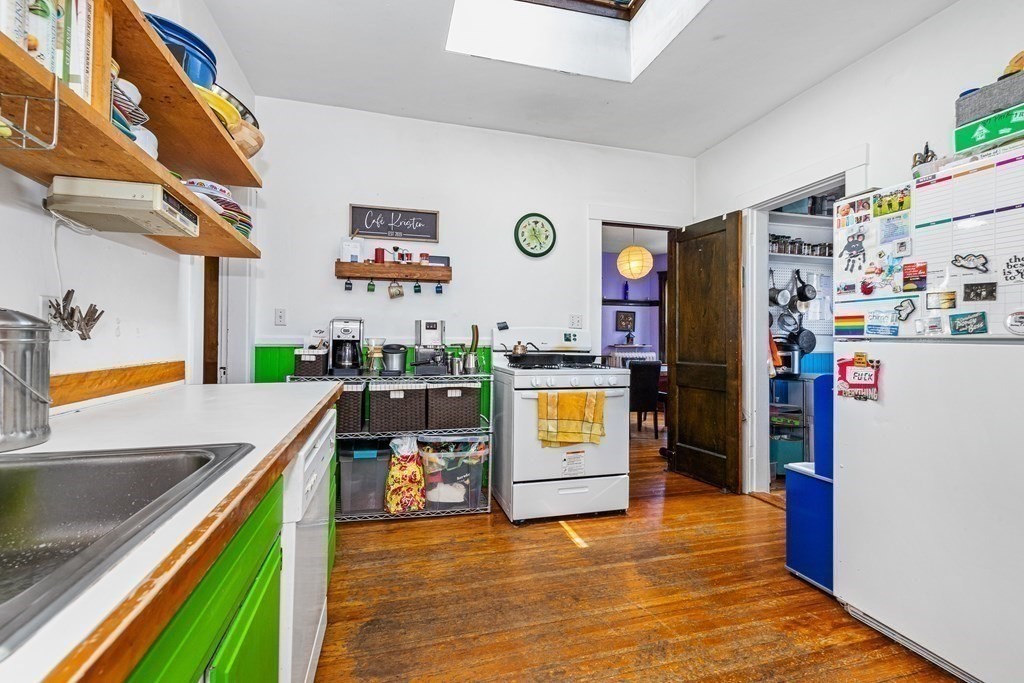 87 Parkton Road Boston, MA 02130 - Photo 6 of 42 a view of a kitchen with fridge and a sink