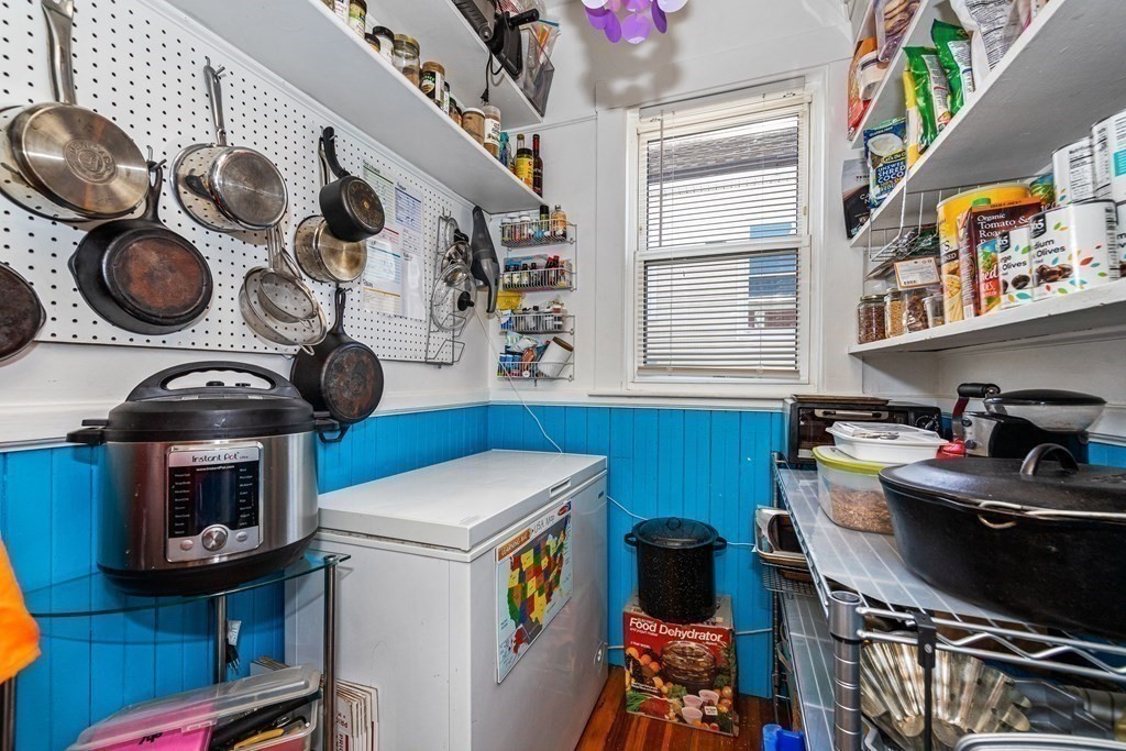 87 Parkton Road Boston, MA 02130 - Photo 7 of 42 a kitchen with a stove and a wooden floor