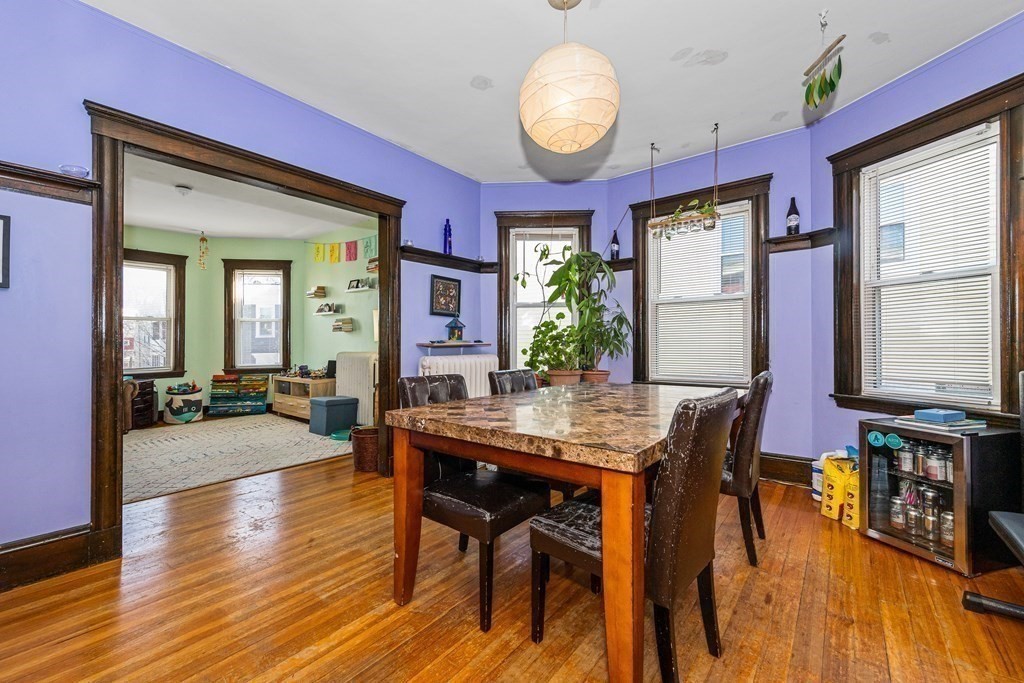 87 Parkton Road Boston, MA 02130 - Photo 8 of 42 a view of a dining room with furniture and wooden floor