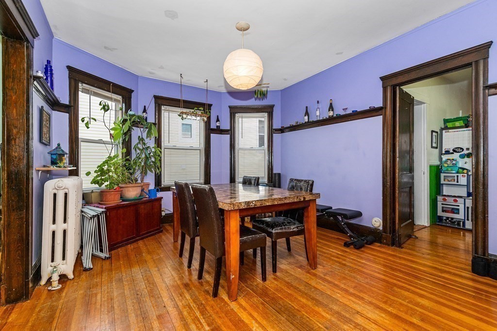 87 Parkton Road Boston, MA 02130 - Photo 9 of 42 a view of a dining room with furniture and wooden floor