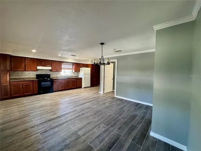 a view of kitchen with wooden floor